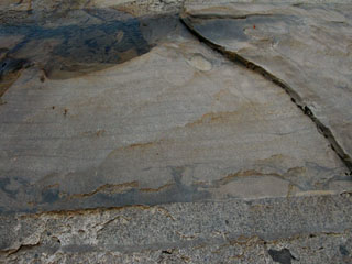Interface between glacier polished smooth rock and rough eroded granite